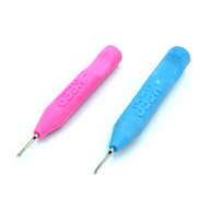Two KEEP placers side by side, one magenta and one blue, each with KEEP embossed in the handle and a fine hollow steel tip.